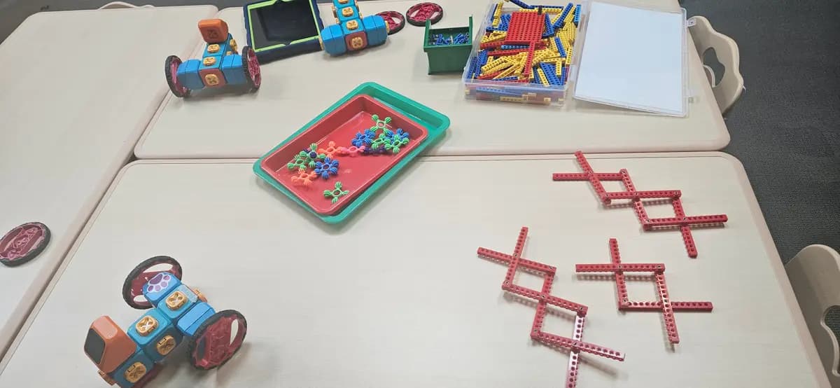 Mini robots and sorting trays, set out for the morning